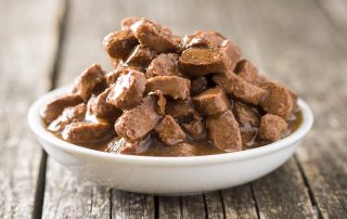 Meal for dog or cat. Canned meat with sauce