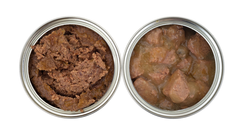 Top view of beef and chicken dog food cans opened on a white background